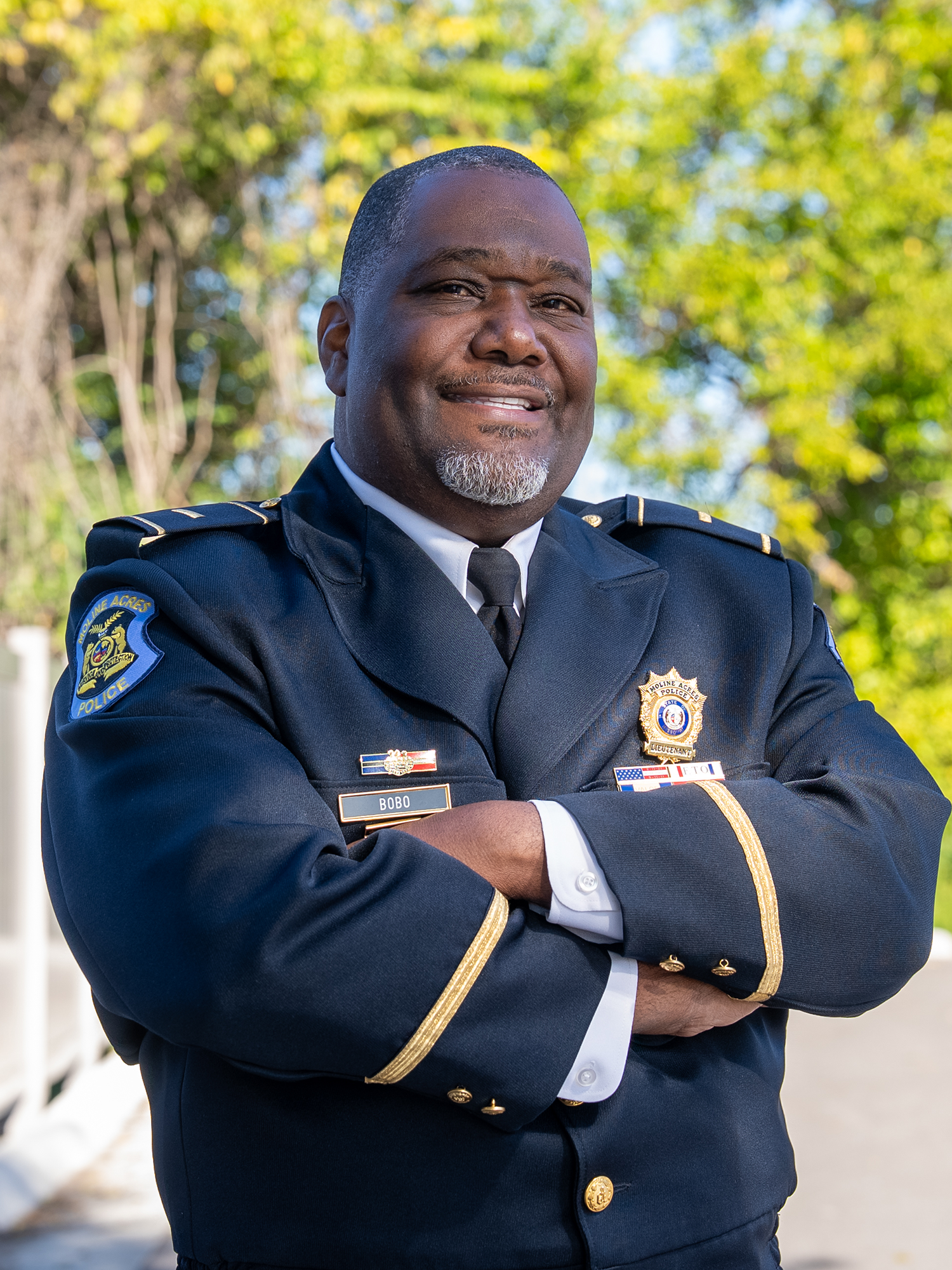 patient in police uniform smiling